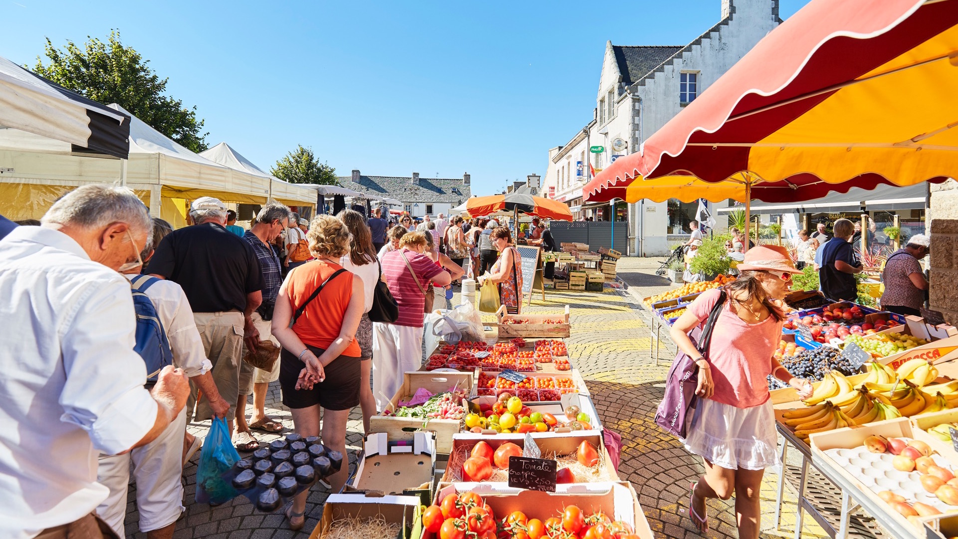 Fruit Stall With People Buying At Morlaix Weekly Market France